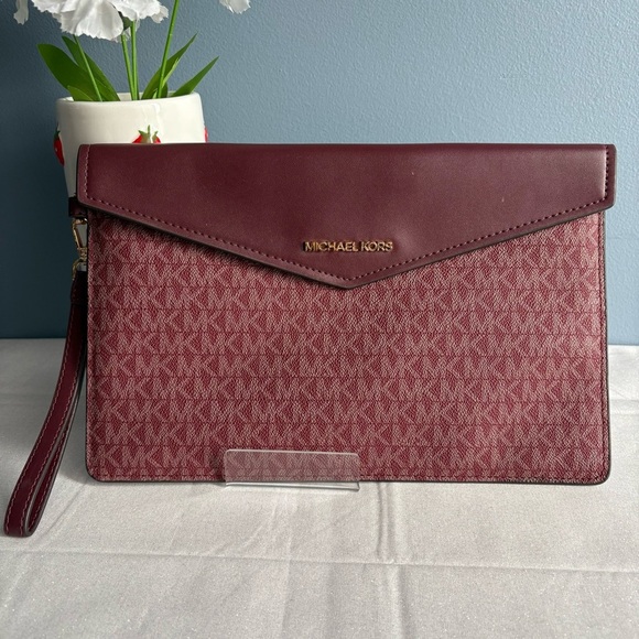 Michael Kors Handbags - Michael Kors Wine Red Monogram Envelope Clutch EUC